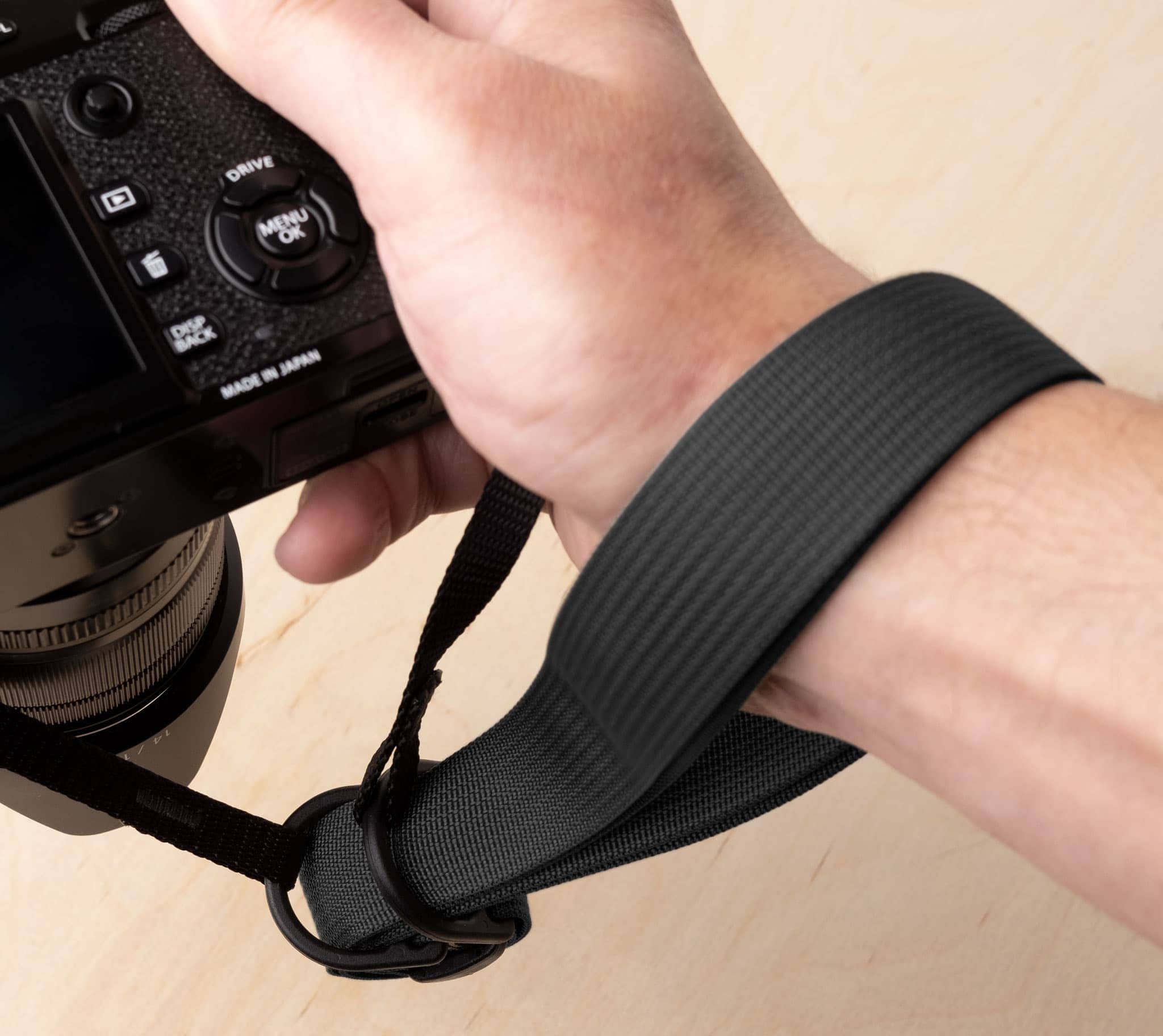 Loop the webbing through the D-rings to use the F1 as a wrist strap.