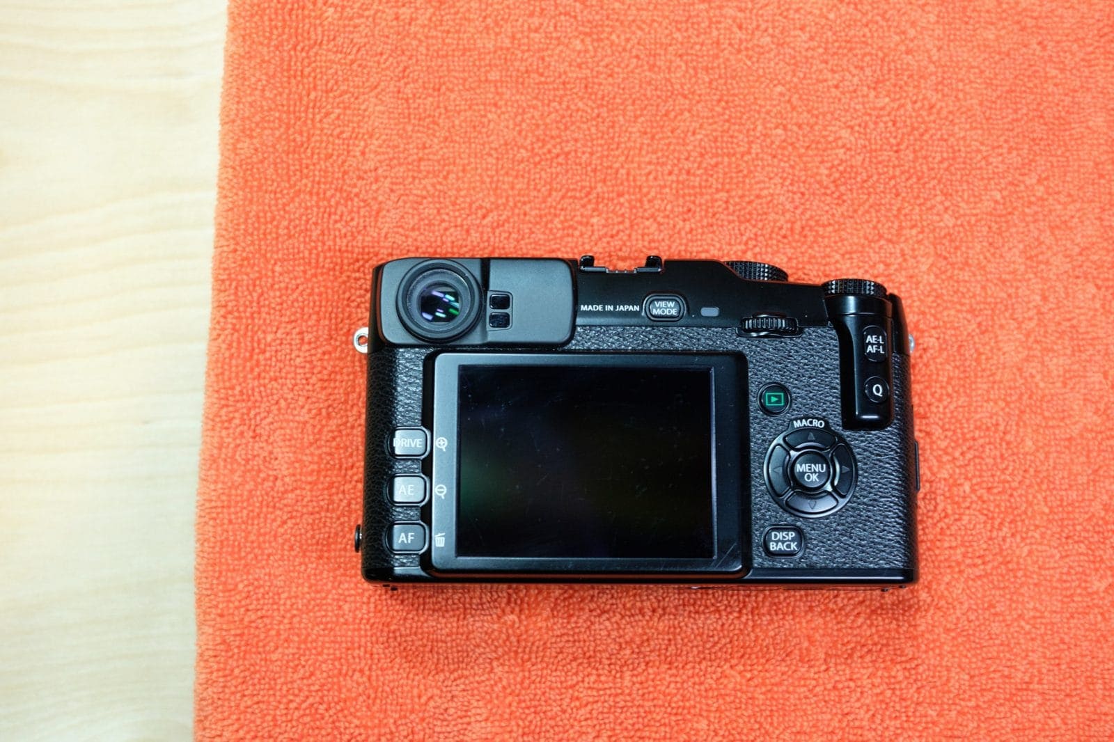 Getting ready to remove the strap lug inserts from your Fuji camera.